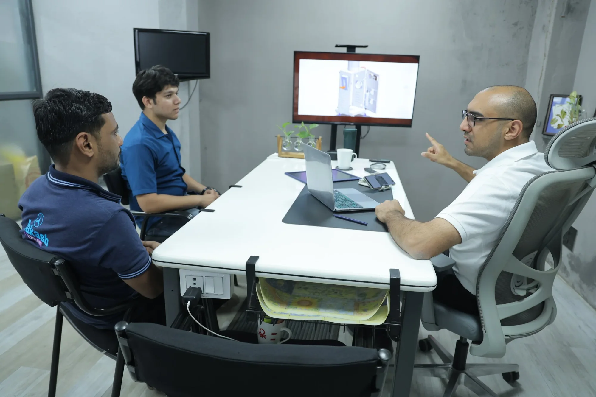 Rock Engines team reviewing an oil change machine design
